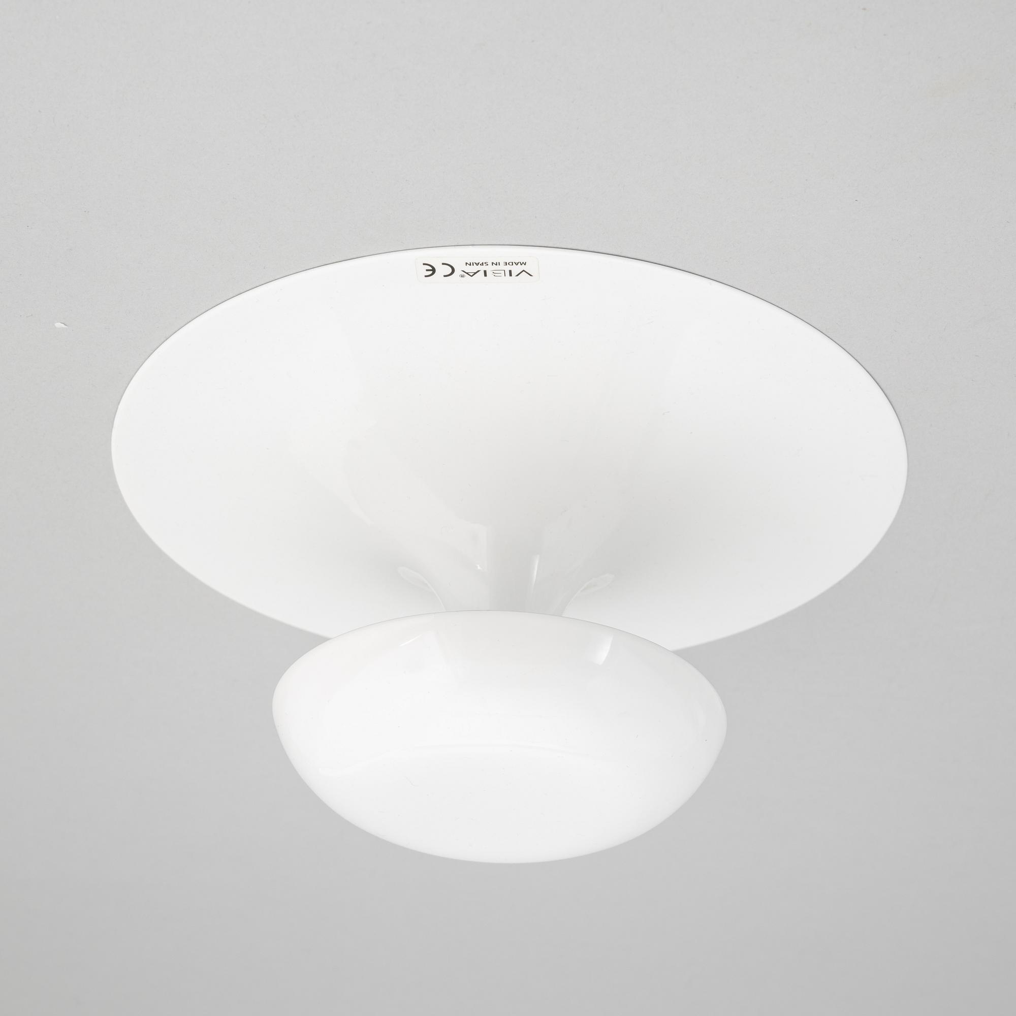 A set of four wall lamps from Vibia, Spain, 21st Century.