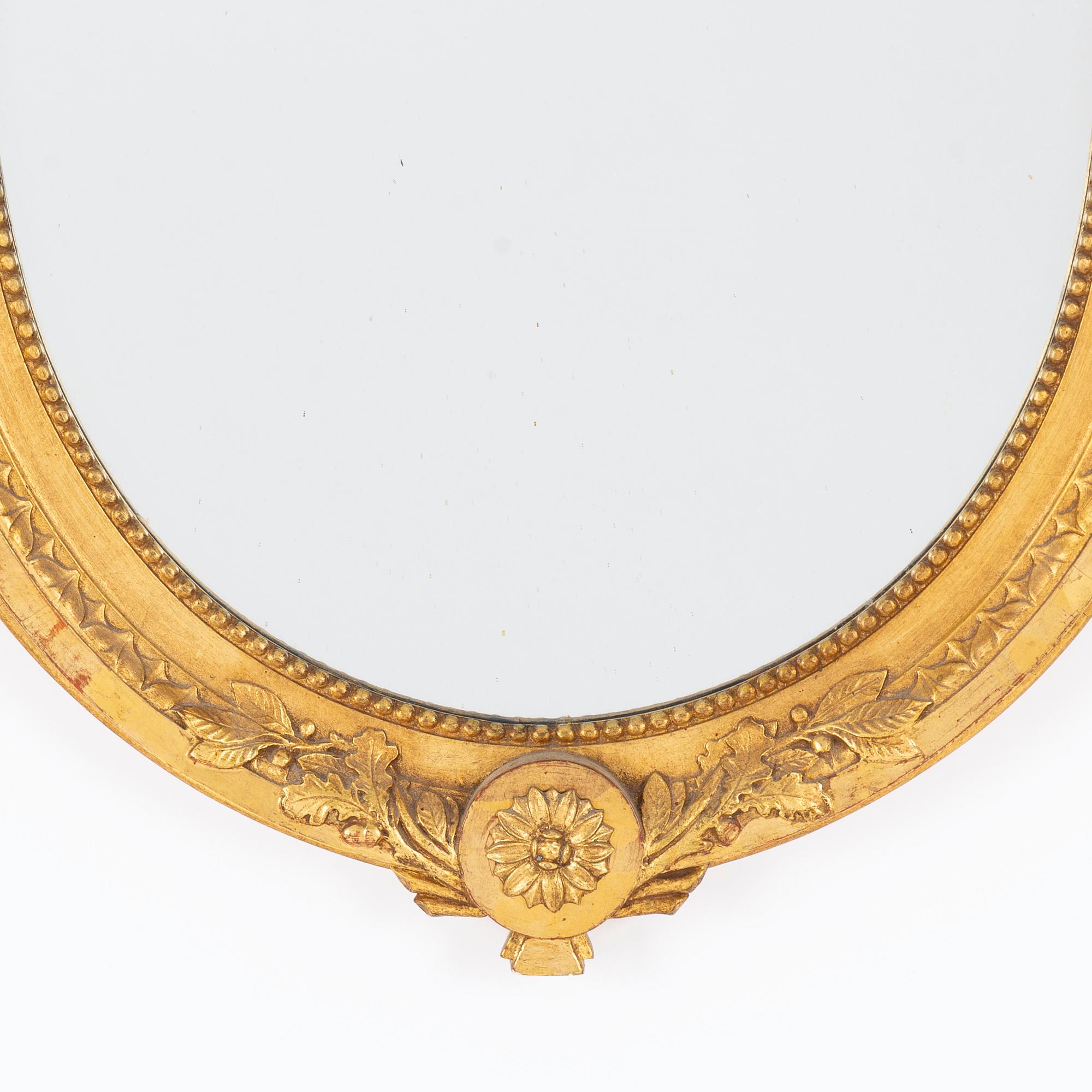 A Gustavian-style gilt-gesso mirror, early 20th century.