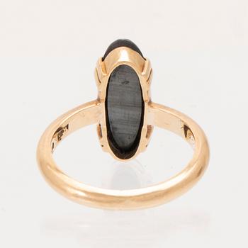 An 18K gold ring with faceted hematite.