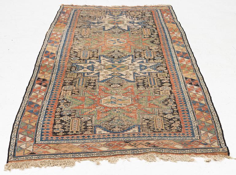 An oriental carpet, c 280 x 130 cm.