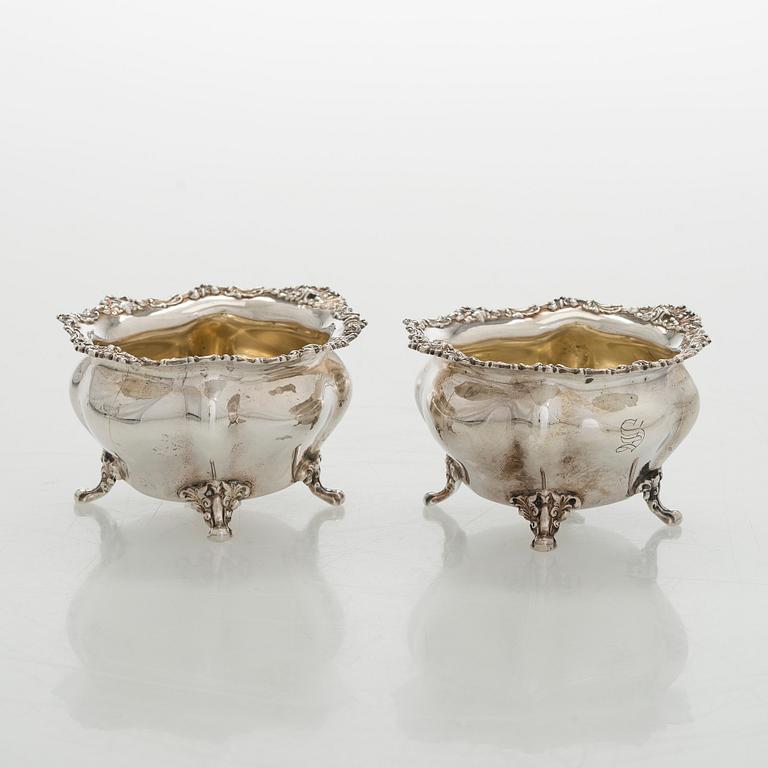 Black Starr & Frost, a pair of sterling silver shakers and sugar bowls, USA around 1900, Gorham pair of sterling spoons.