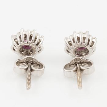 Pendant with gold chain, 
Pendant with white gold chain, 
Earrings a pair, rubies with brilliant-cut diamonds.