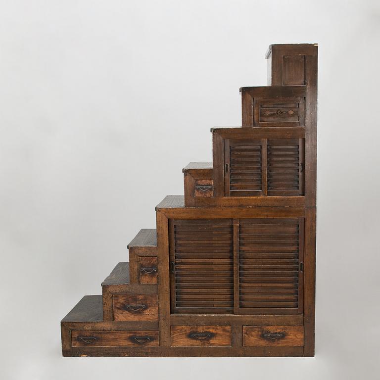 A Japanese chest of drawers / cabinet so-called "Step Tansu" in cedar wood, 19th century.