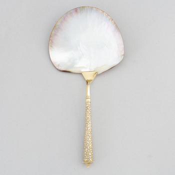 A silver and mother of pearl serving spoon, P. Hertz, Copenhagen, Denmark, 1885.