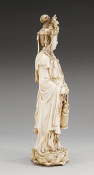 A Japanese ivory figure of Guanyin, probably Meiji period (1868-1912). Signed.