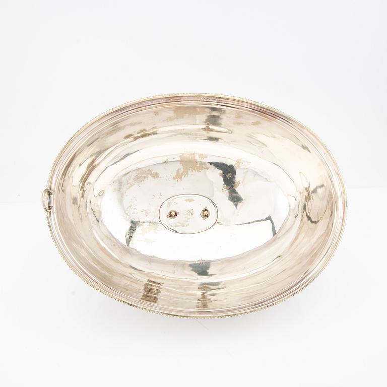 Two frying pan lids and a footed bowl, NPNS, 20th century.