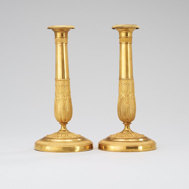 A pair of French Empire early 19th century candlesticks.