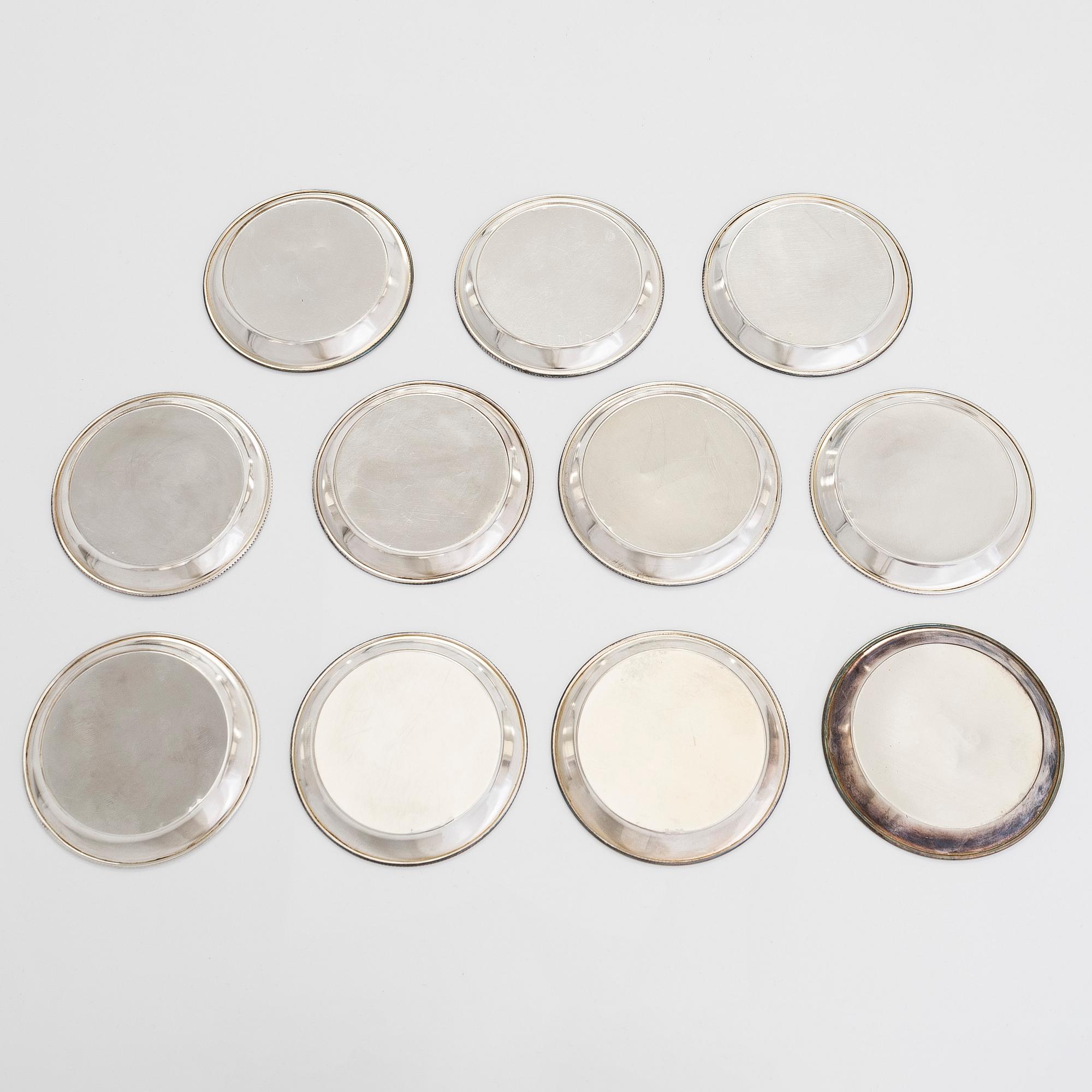 A 21-piece set of 'Chippendale' silver cutlery, and 11 silver coaster, Turku and Hämeenlinna, 1983-90 and 1964.
