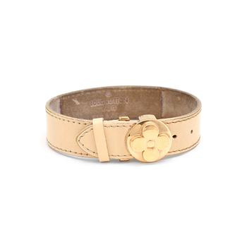 555. LOUIS VUITTON, a beige leather bracelet.