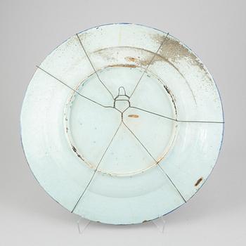 A large faience dish, 18th Century.