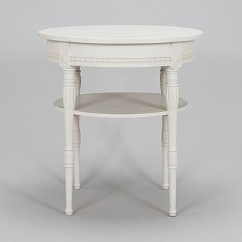 A Gustavian style small round table from first half of the 20th century.