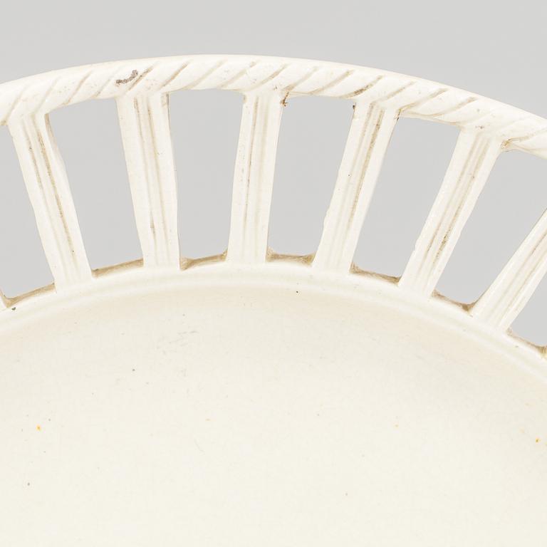 TWO CREAMWARE PLATES, one marked Wedgwood, first half of the 19th century and late 18th century.