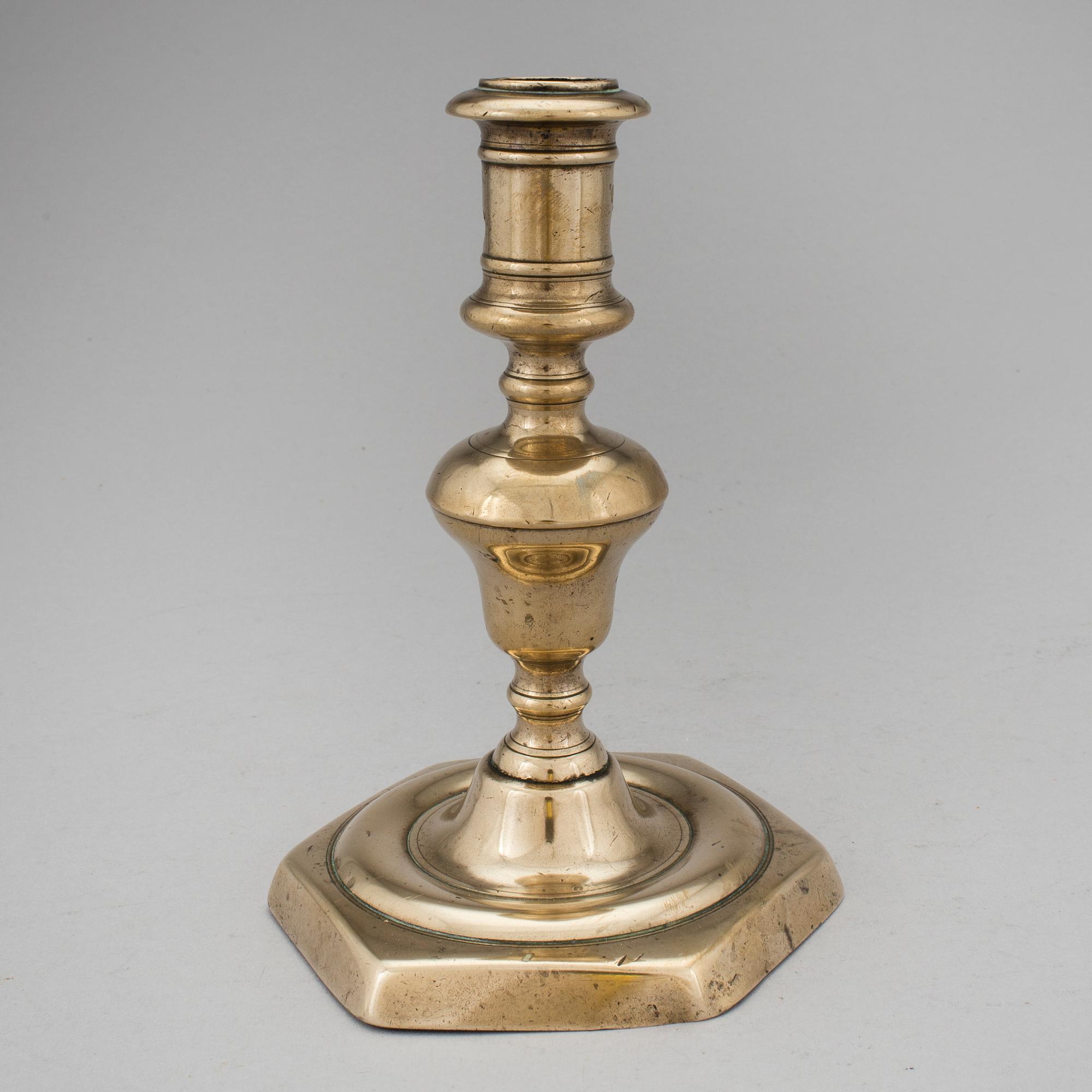 A BRONZE BAROQUE CANDLESTICK, 17th century.