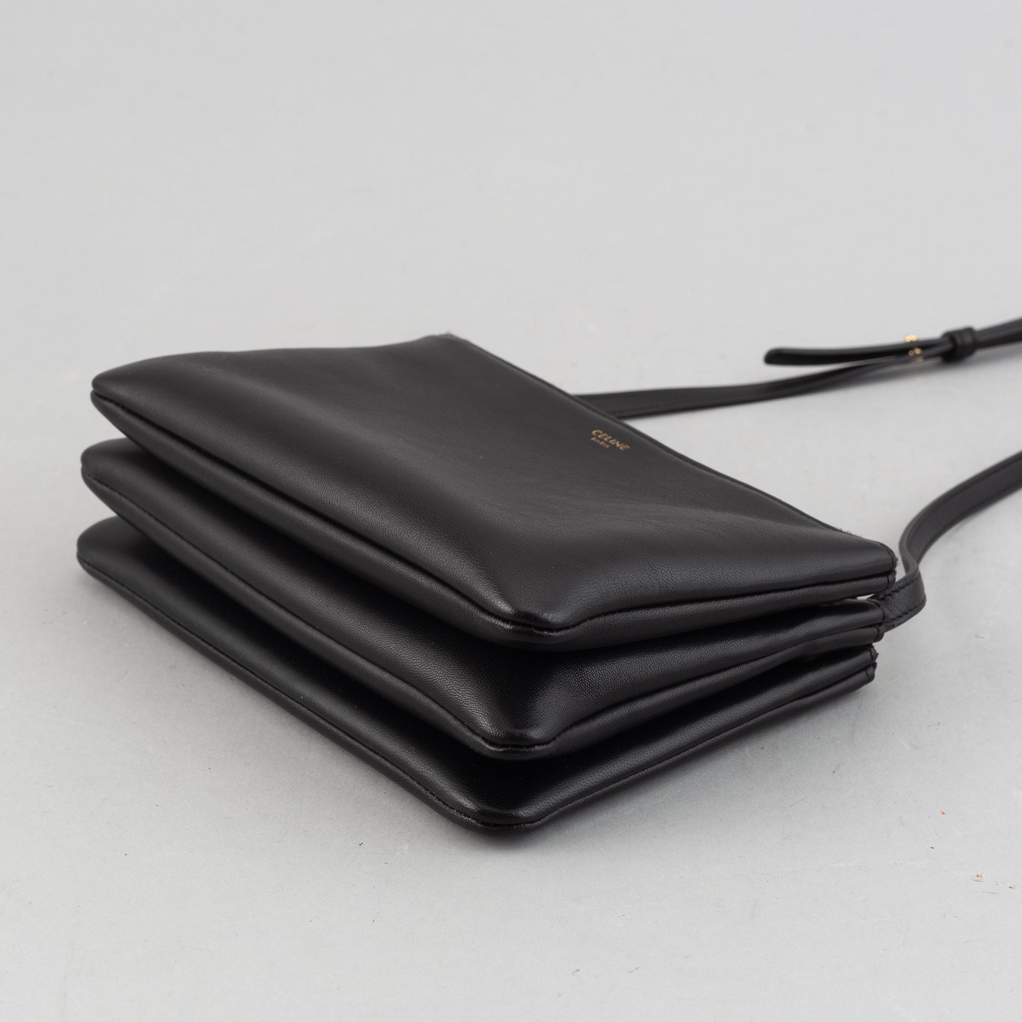 Céline, a black leather 'Trio Bag'.