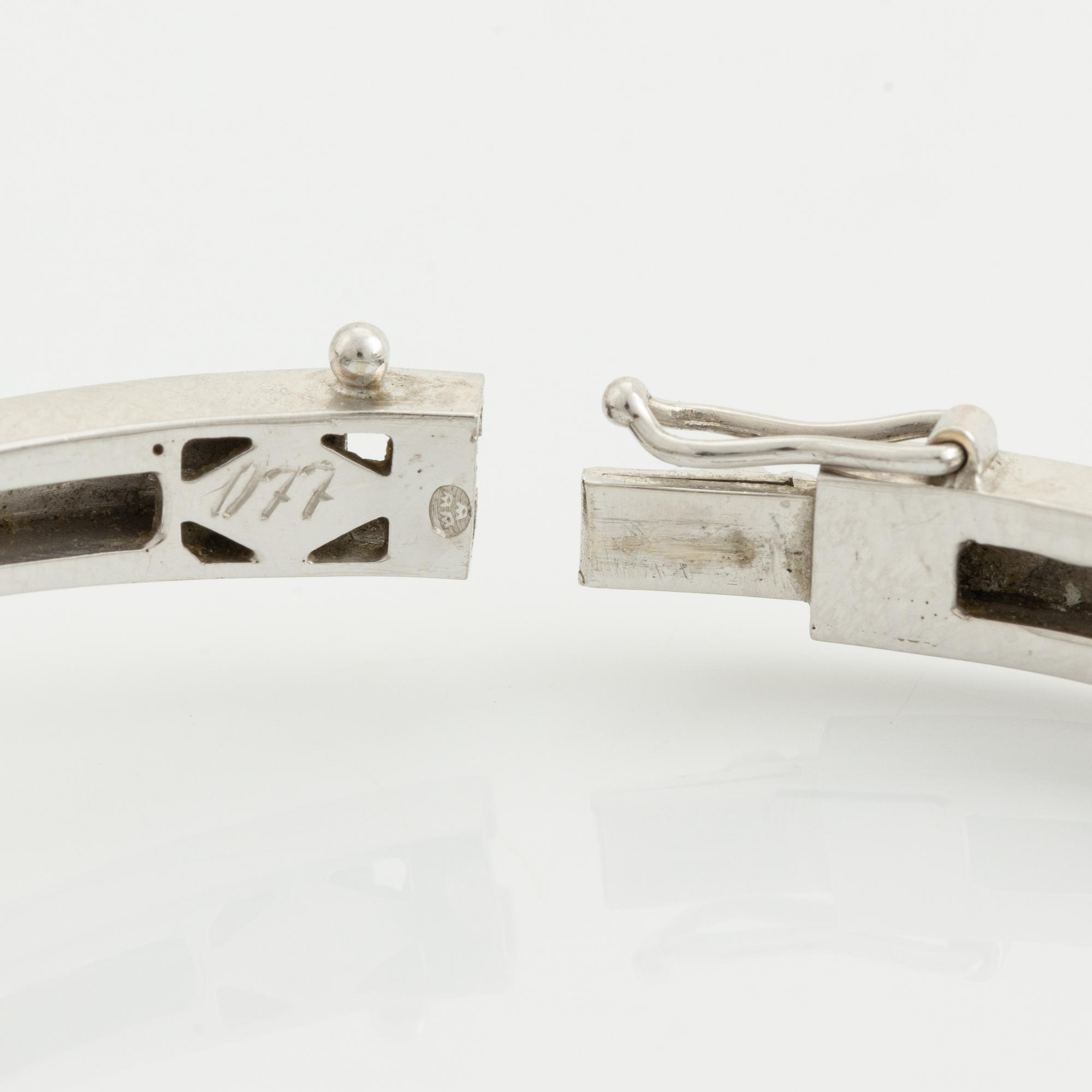 White gold and brilliant cut diamond bangle.