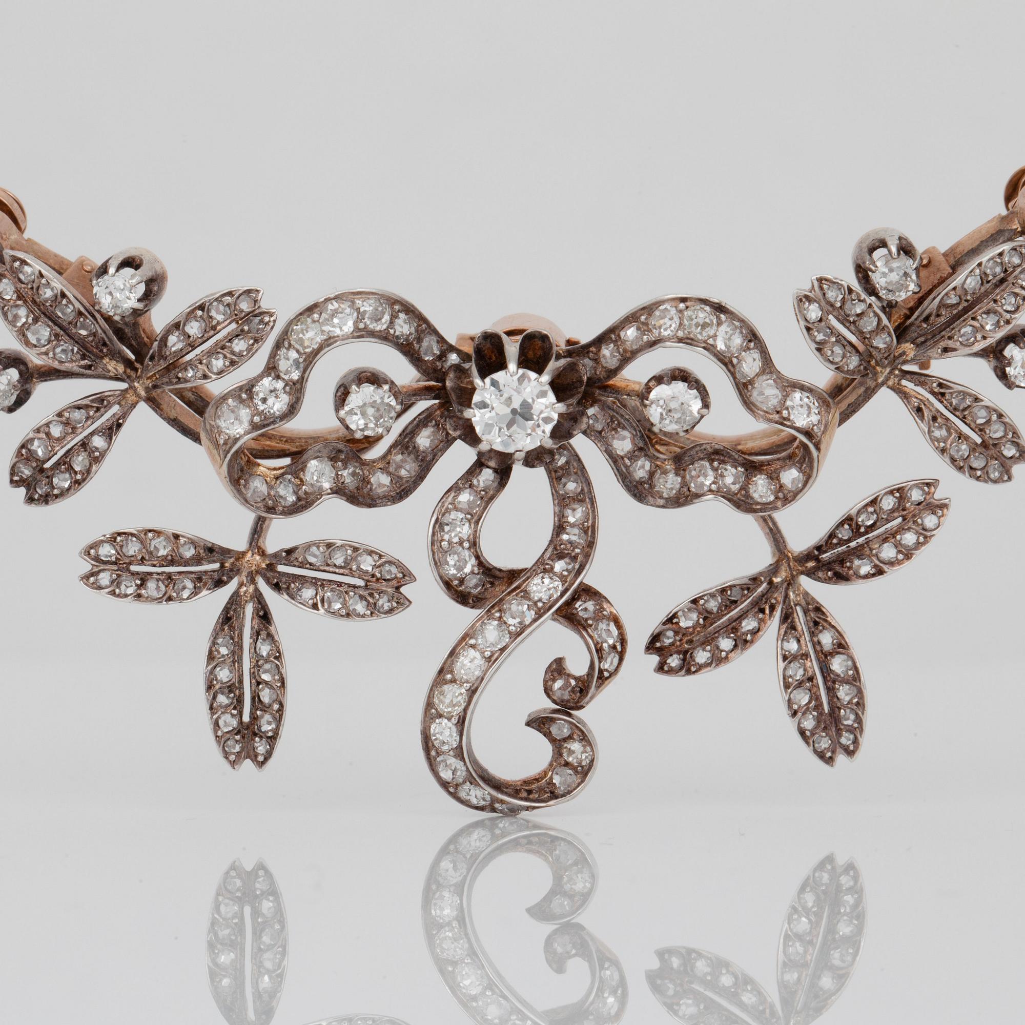 An old-cut diamond and natural saltwater pearl parure. Total carat weight of diamonds circa 11.00 cts.