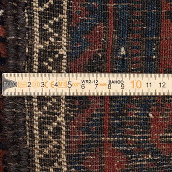 A semi-antique rug, baluch, including flat weave ca. 216 x 110 cm.