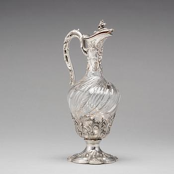 A French mid 19th century parcel-gilt silver and glass wine-jug.