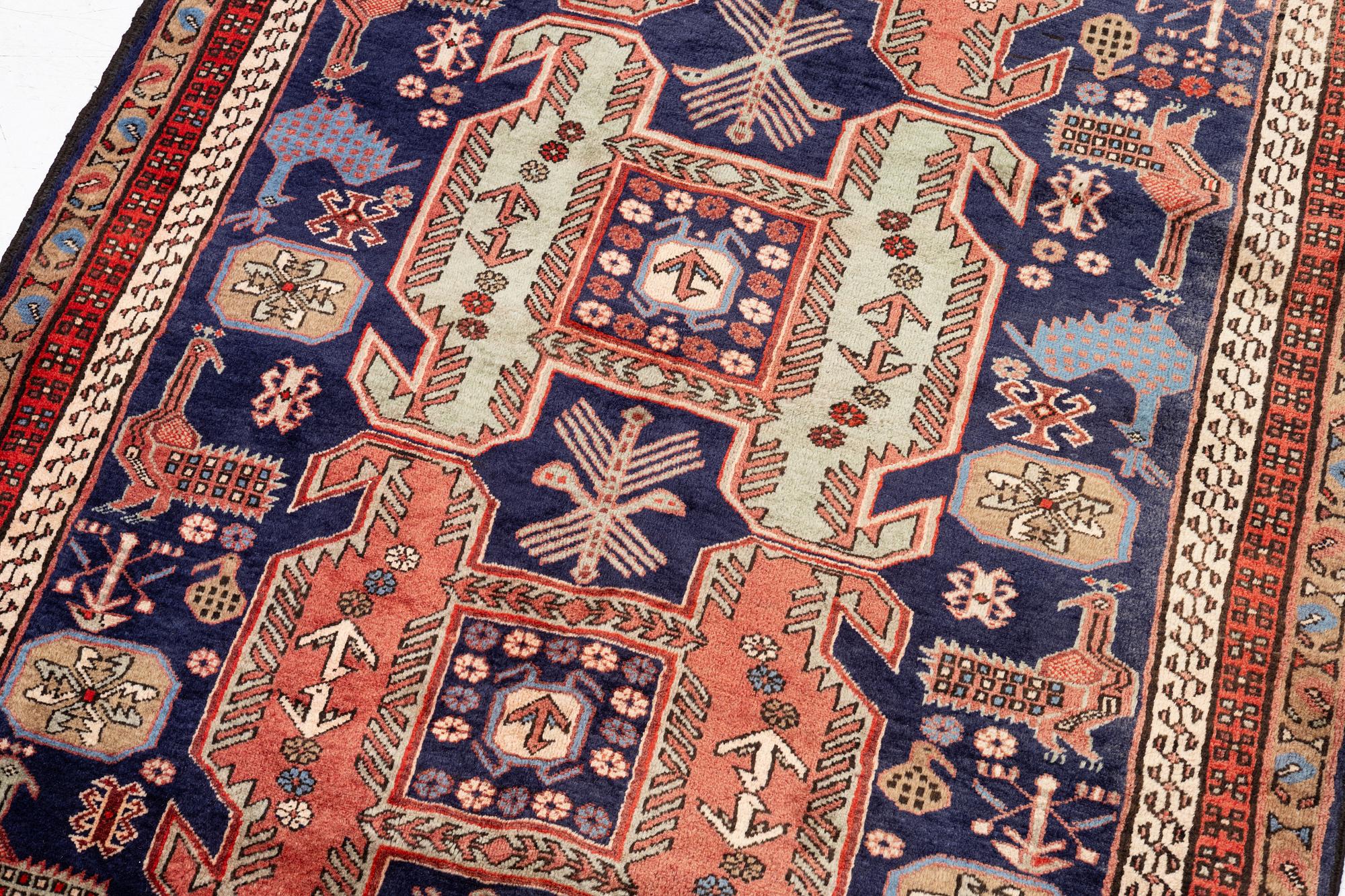 A Sarab carpet, c. 305 x 137 cm.