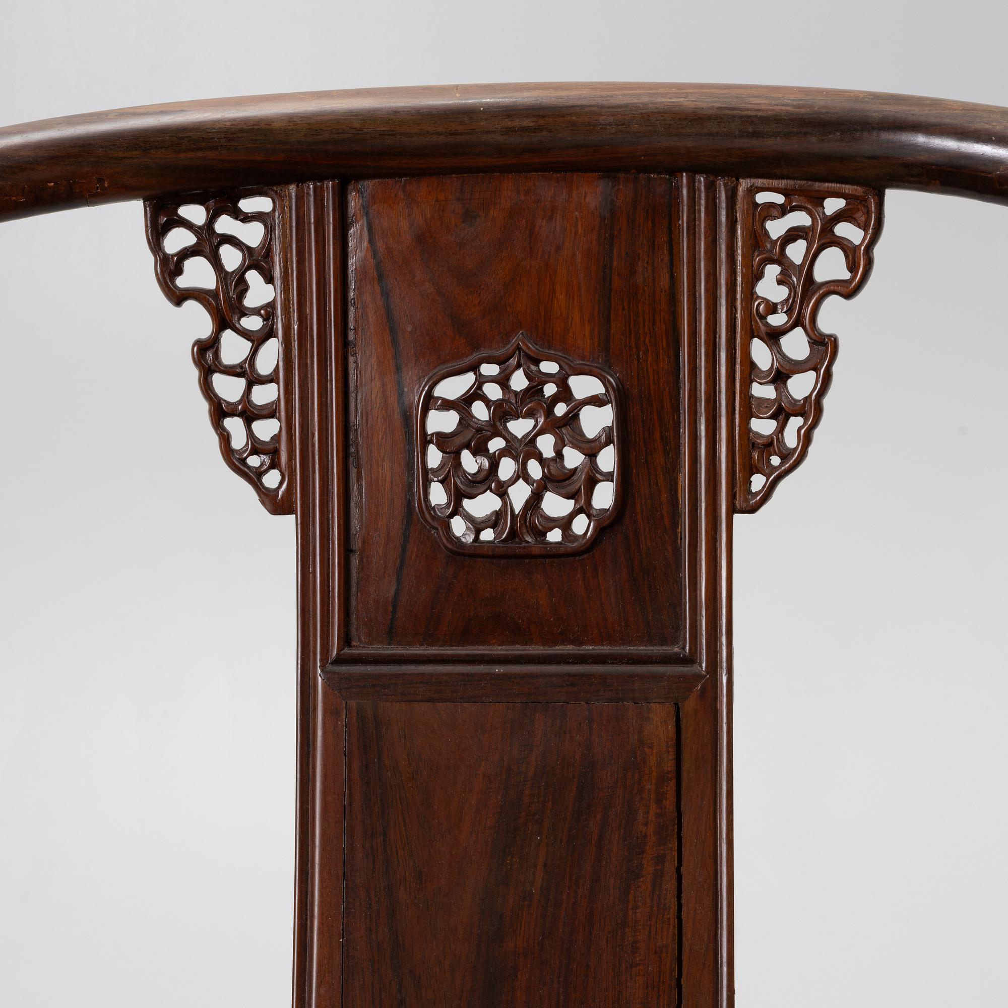 A pair of Chinese horseshoe-back hardwood armchairs, 1900s.