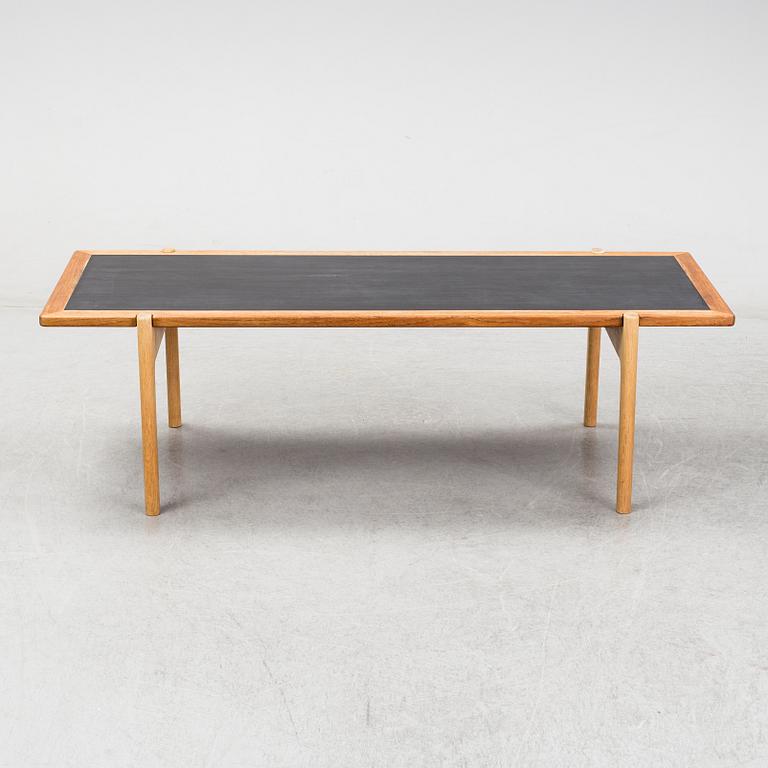A model JH 575 coffee table by Hans J Wegner for Johannes Hansen.