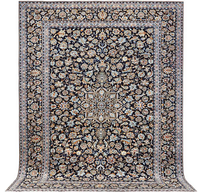 A Kashan carpet, signed, c. 381 x 285 cm.