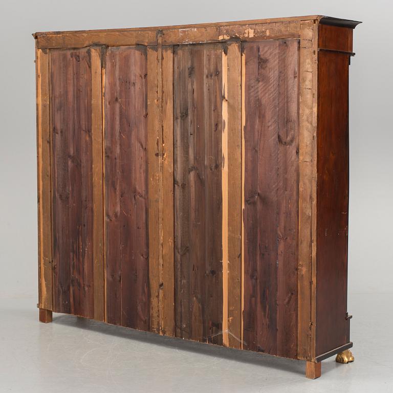 A mid 1800s Empire bookcase.