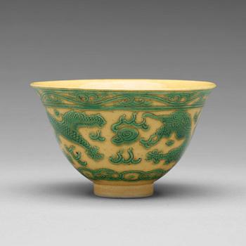 773. A yellow ground 'dragon' bowl, Qing dynasty, with Kangxis six character mark.