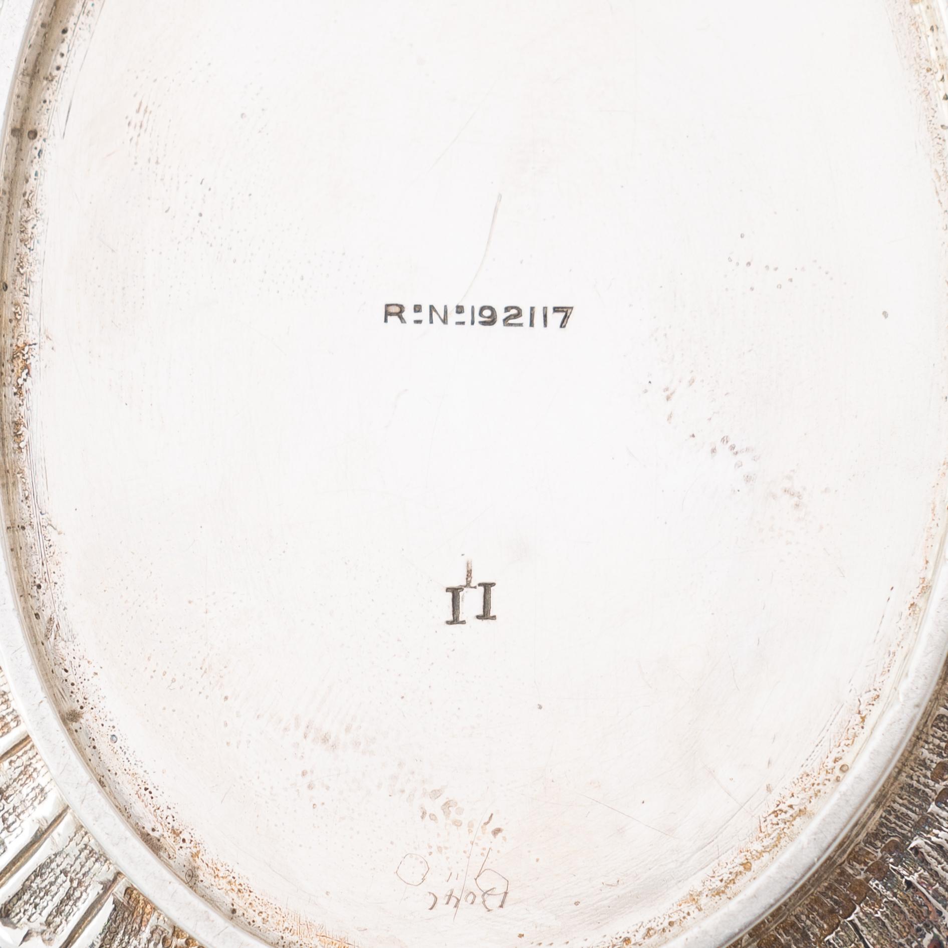 An English 3-piece sterling silver tea set, maker's mark of William Comyns & Sons, London 1892.