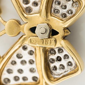 Necklace, butterfly, 18K gold with blue sapphire and brilliant-cut diamonds.