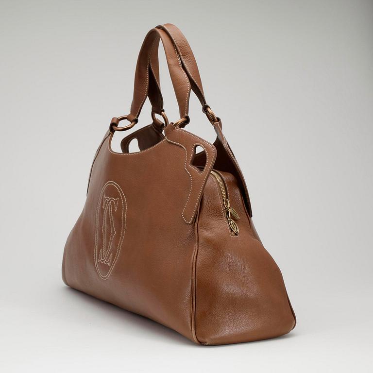 CARTIER, a brown leather bag.