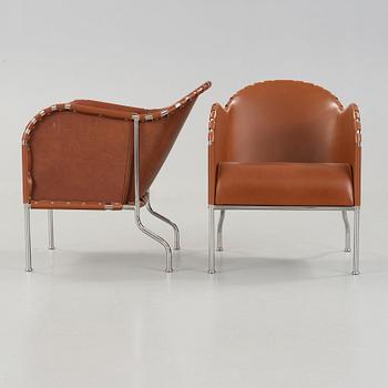 Mats Theselius, A pair of 'Bruno' brown leather and steel easy chairs, Källemo, Sweden.