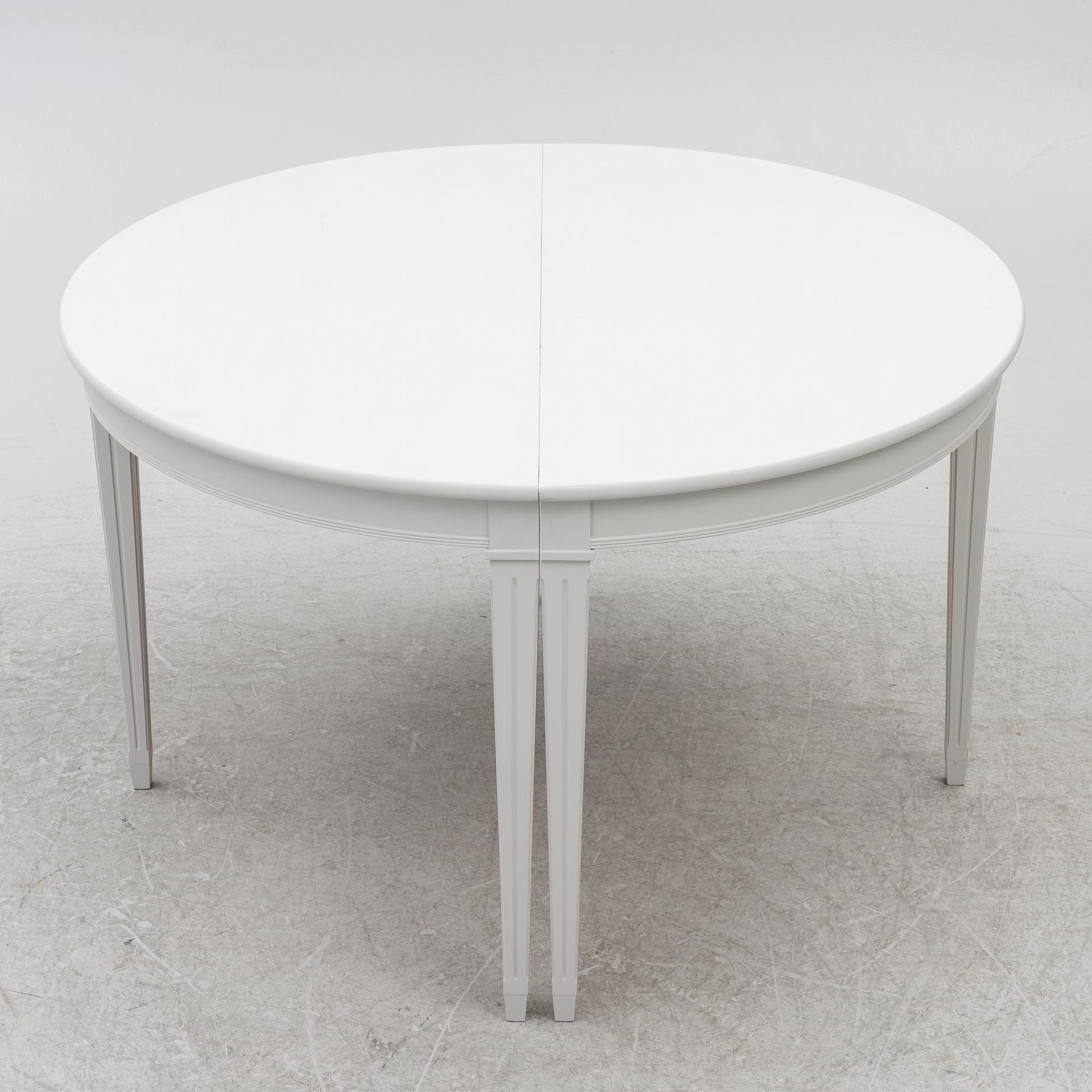 A pair of crescent shaped tables, 20th century.
