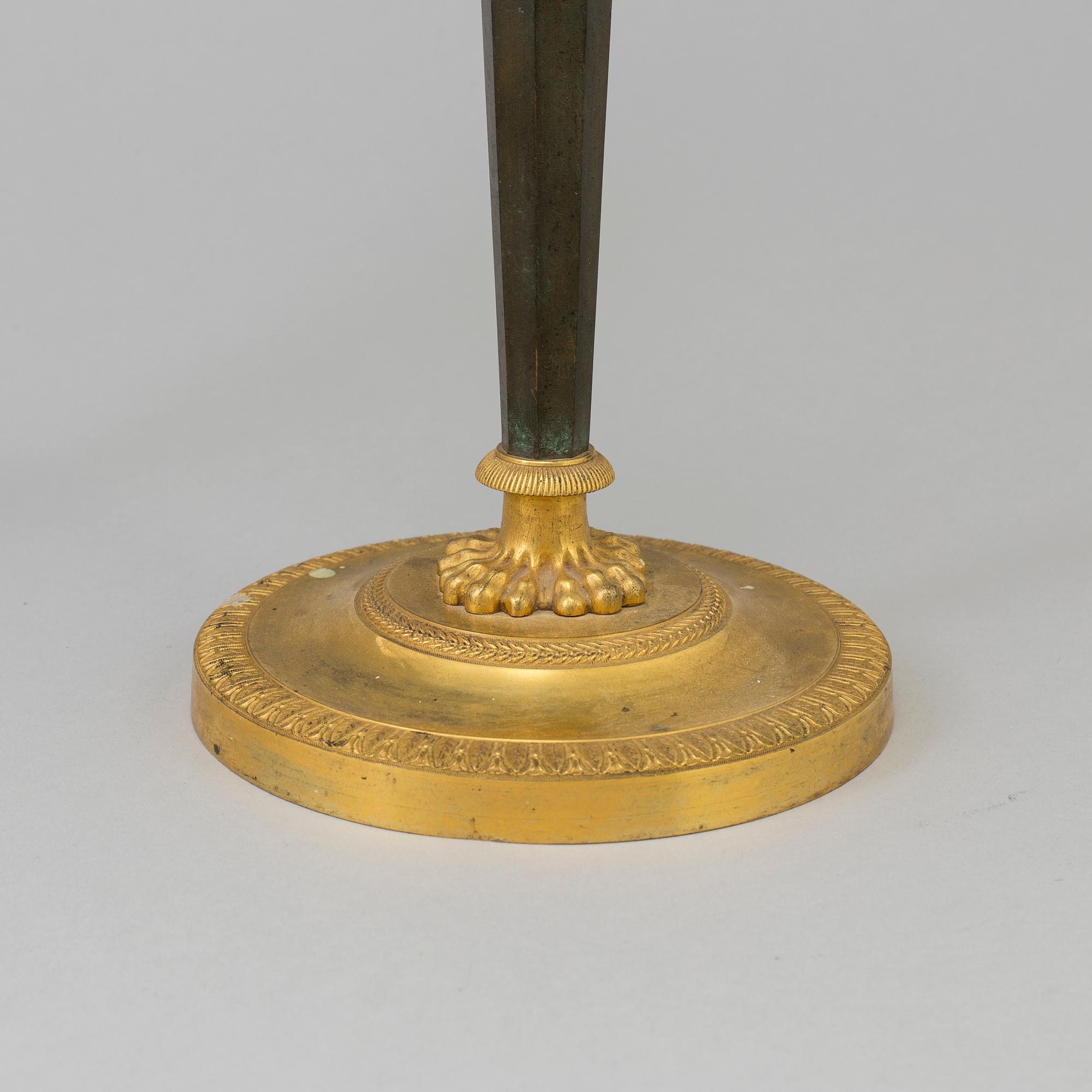 A pair of French Directoire late 18th century ormolu candelabra for three candles.