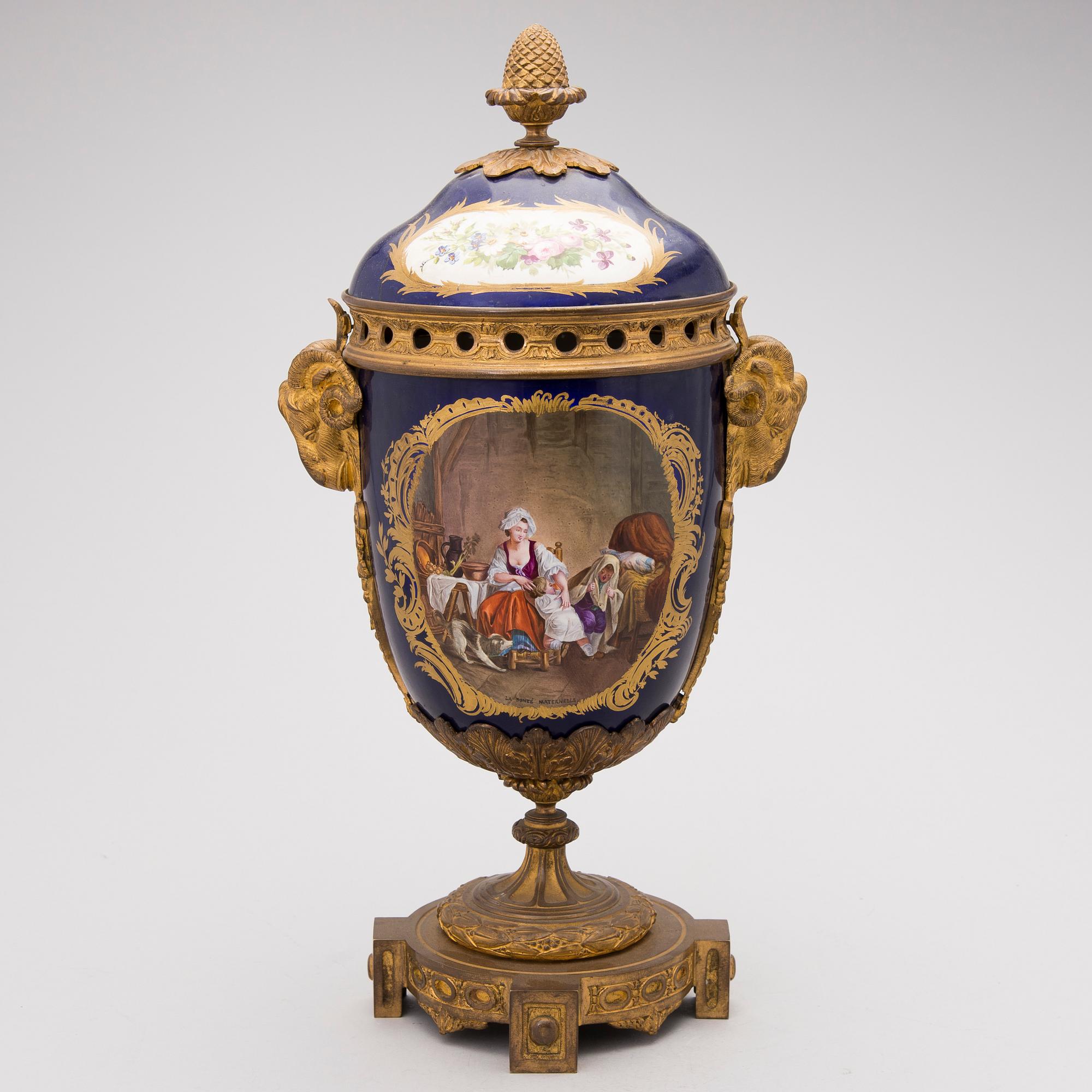A FRENCH SÈVRES STYLE URN, porcelain and gilt bronze, latter half of the 19th century.