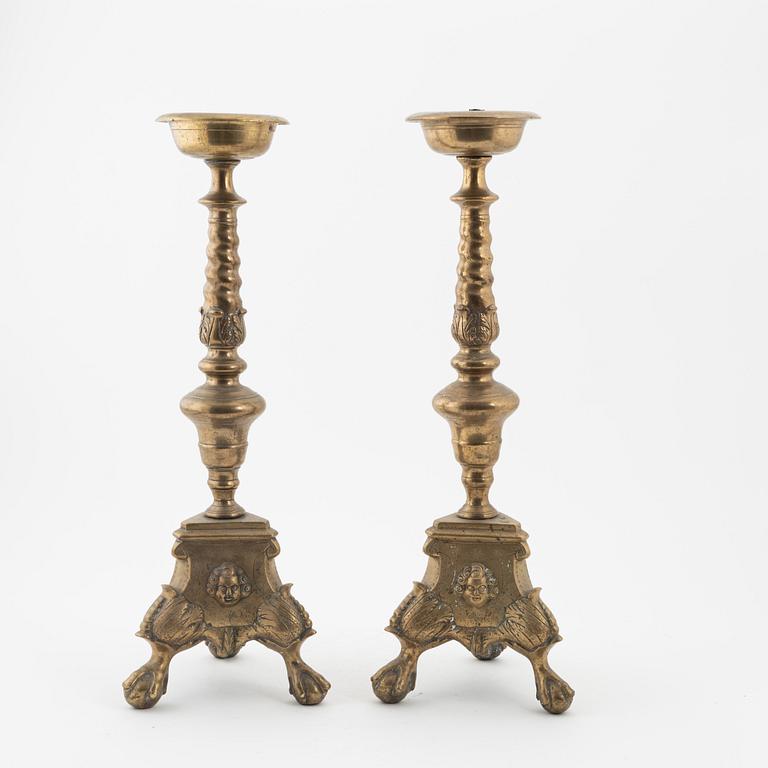 A pair of Baroque-style bronze candlesticks, 19th Century.