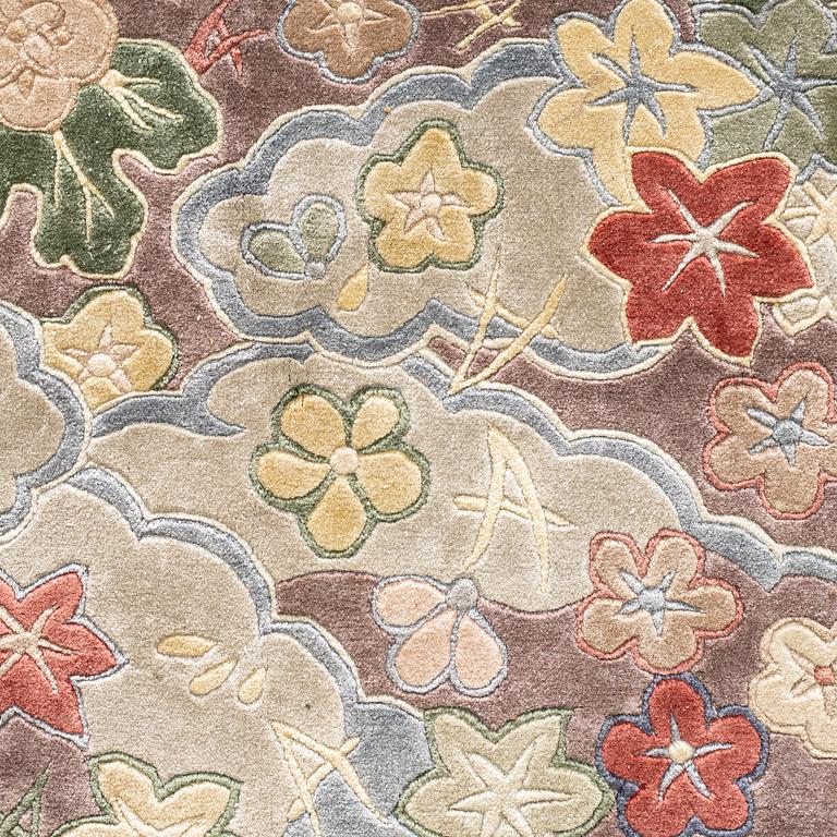 A carpet, Old silk China, ca 242 x 170 cm.