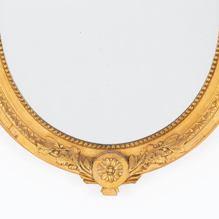 A Gustavian-style gilt-gesso mirror, early 20th century.