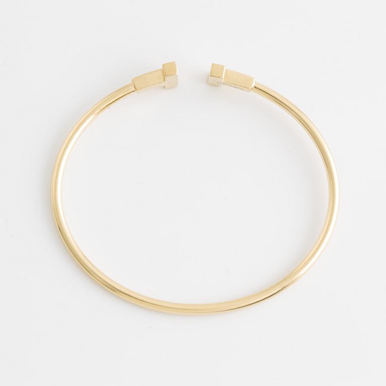 Tiffany & Co armband "T" 18K guld.