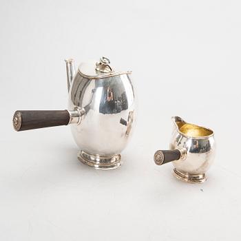 A Swedish 20th century silver coffee pot and creamer, mark of GAB Stockholm 1946 and 1948.