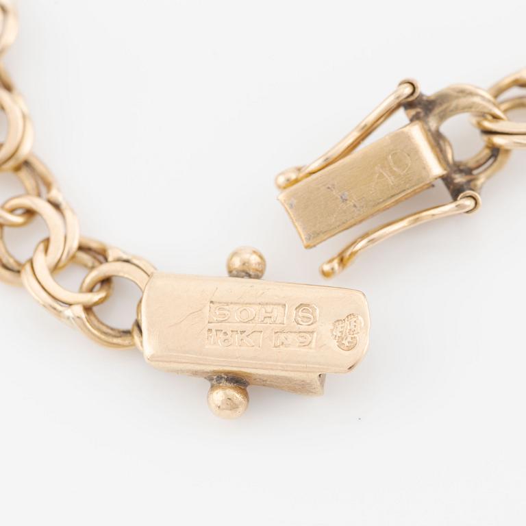 Armband, 18K guld med berlocker.