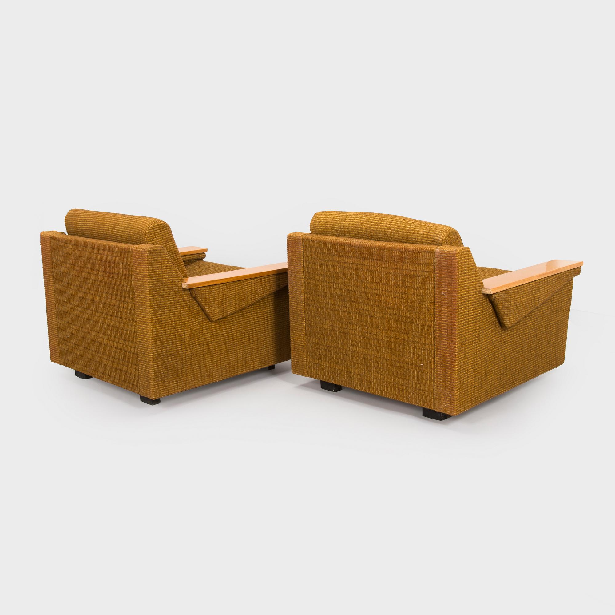 A pair of 1970s armchairs.