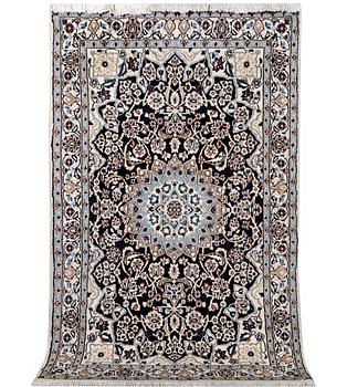 A Nain rug, part silk, 9 laa, c. 210 x 119 cm.