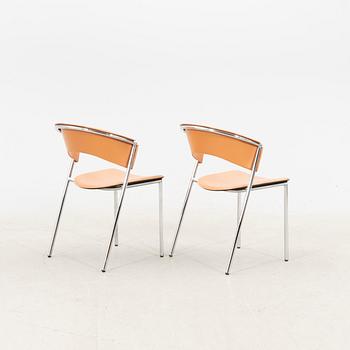 A set of four 21st century leather Italian chairs.