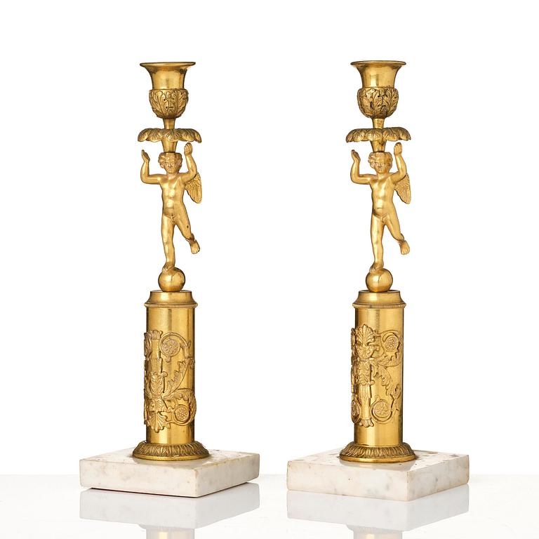 A pair of late Gustavian marble and omrolu candlesticks, late 18th century.