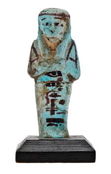 A faiance ushebeti, presumably 21 dynasty Egypt 1070-945 B C.