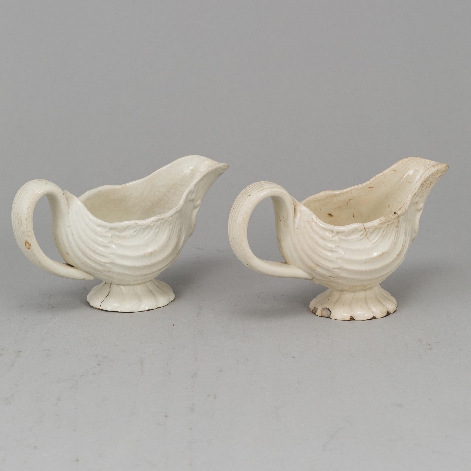 A creame weare buttertureen with cover, a cake mould and a pair of sauce boats, 18/19th Century, part Rörstrand.