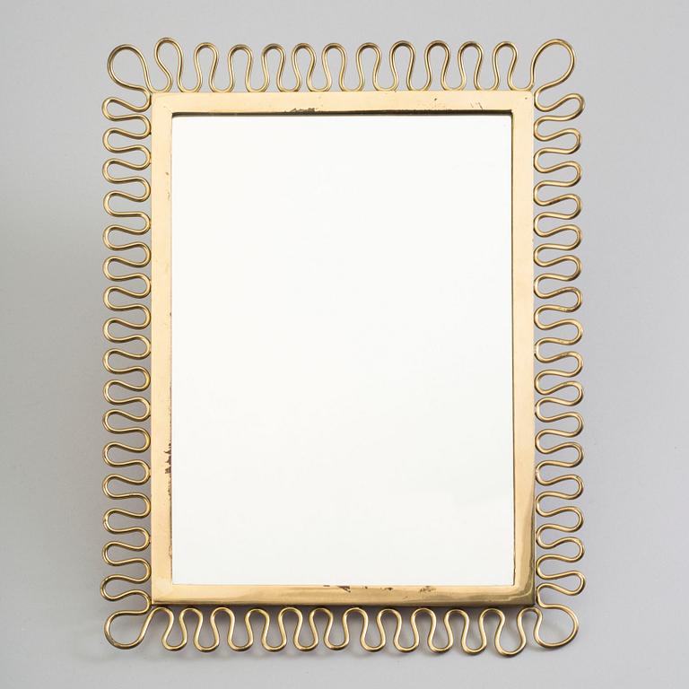 A first half of the 18th century brass mirror.