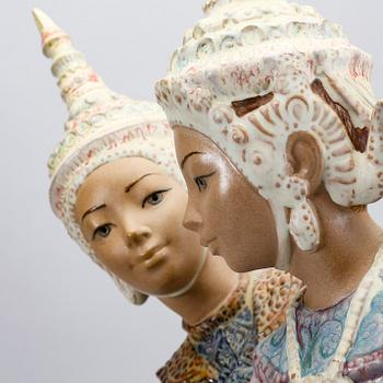 A Lladro stone ware figurine.