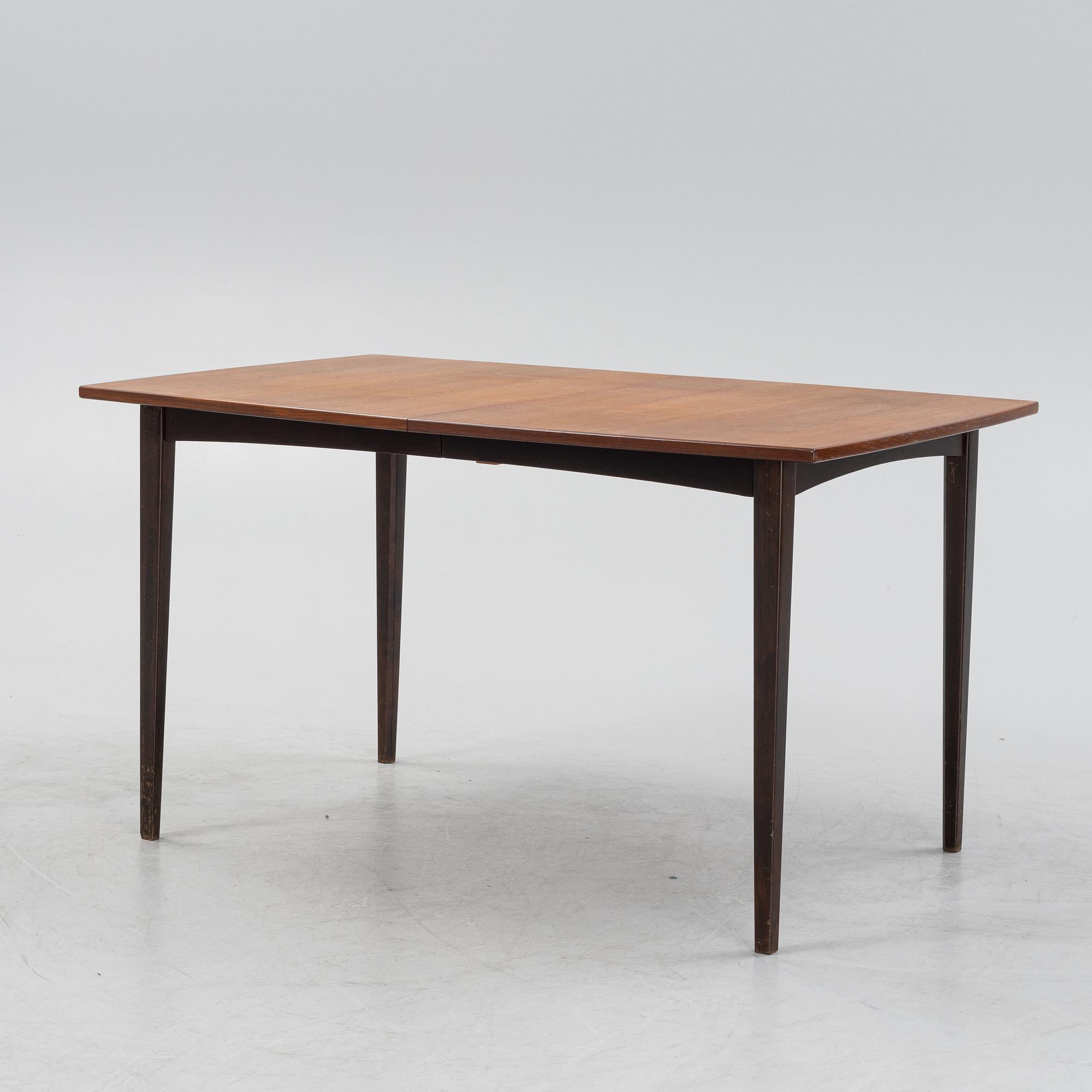 A teak dining table, mid 20th Century.
